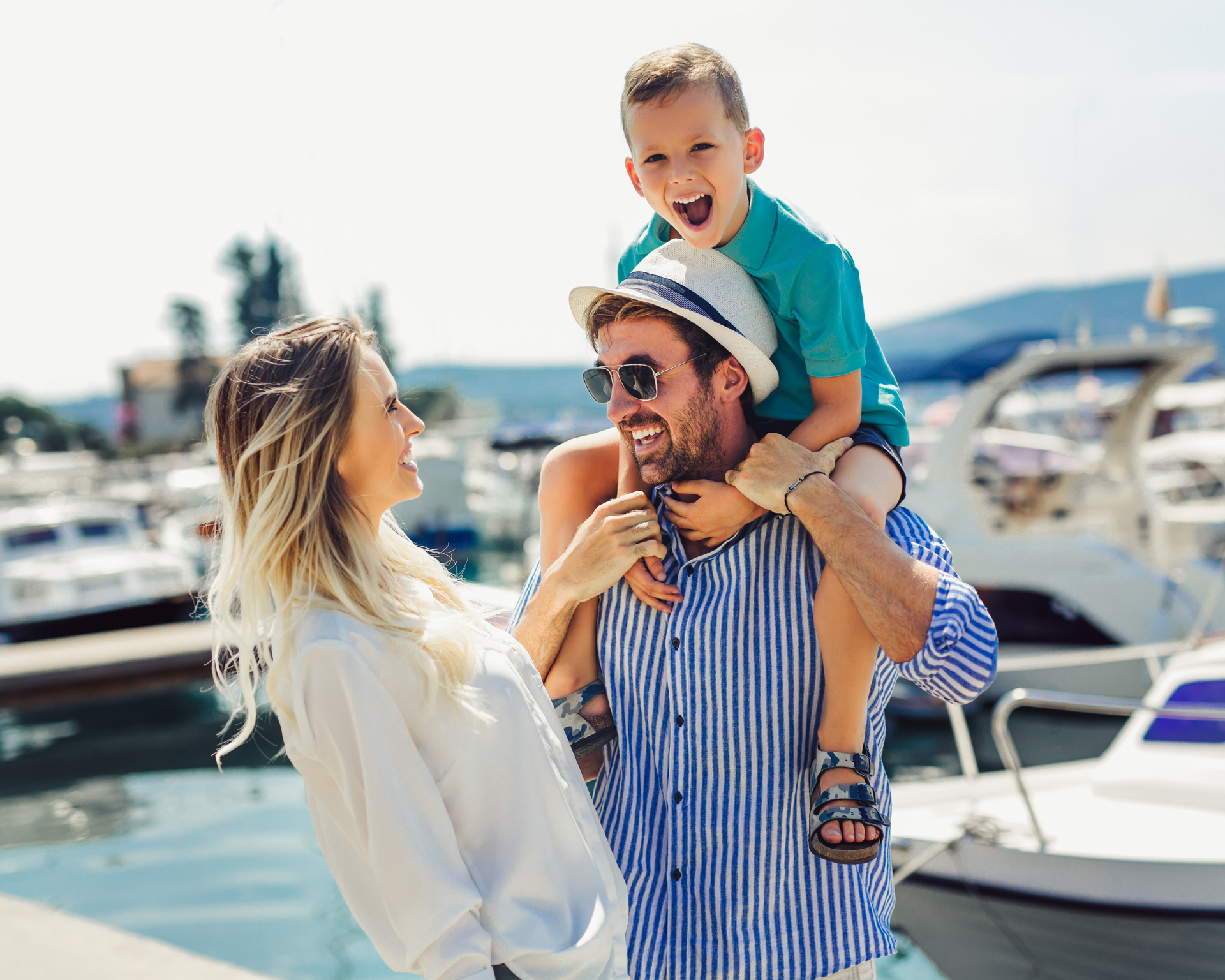 Happy family laughing on the dock