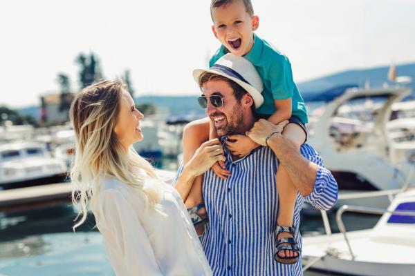 Happy family laughing on the dock