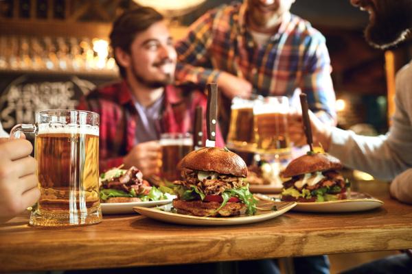 Friends dining at the pub with food